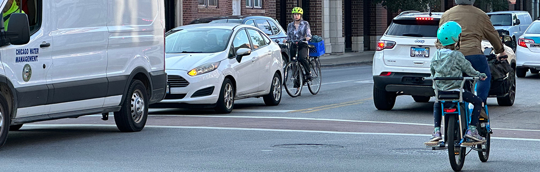 Street scene with people riding bikes